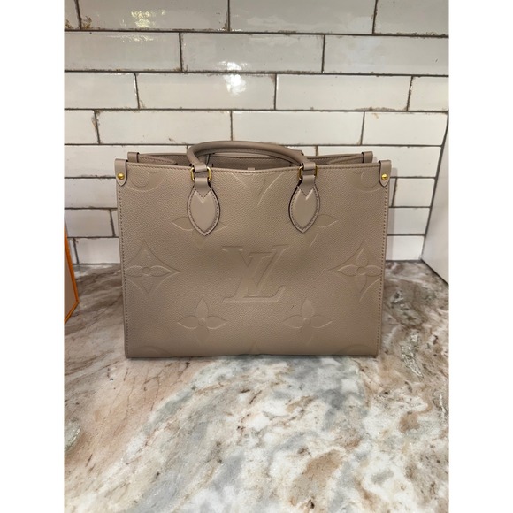 Louis Vuitton Handbags - Louis Vuitton OnTheGo MM Monogram Empreinte Leather Tourterelle Tote Bag M45494